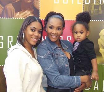 Teen mom, Jazamin McCurdy, said she's determined to make changes in her life after hearing the inspirational words of Demetria McKinney and Vivica A. Fox during the Black Women's Roundtable Healthy, Wealthy & Wise National Tour stop in Riverdale, GA. (L-R) McCurdy and Fox with McCurdy's daughter, Aaranii.  PHOTO CREDIT: Clyde Bradley